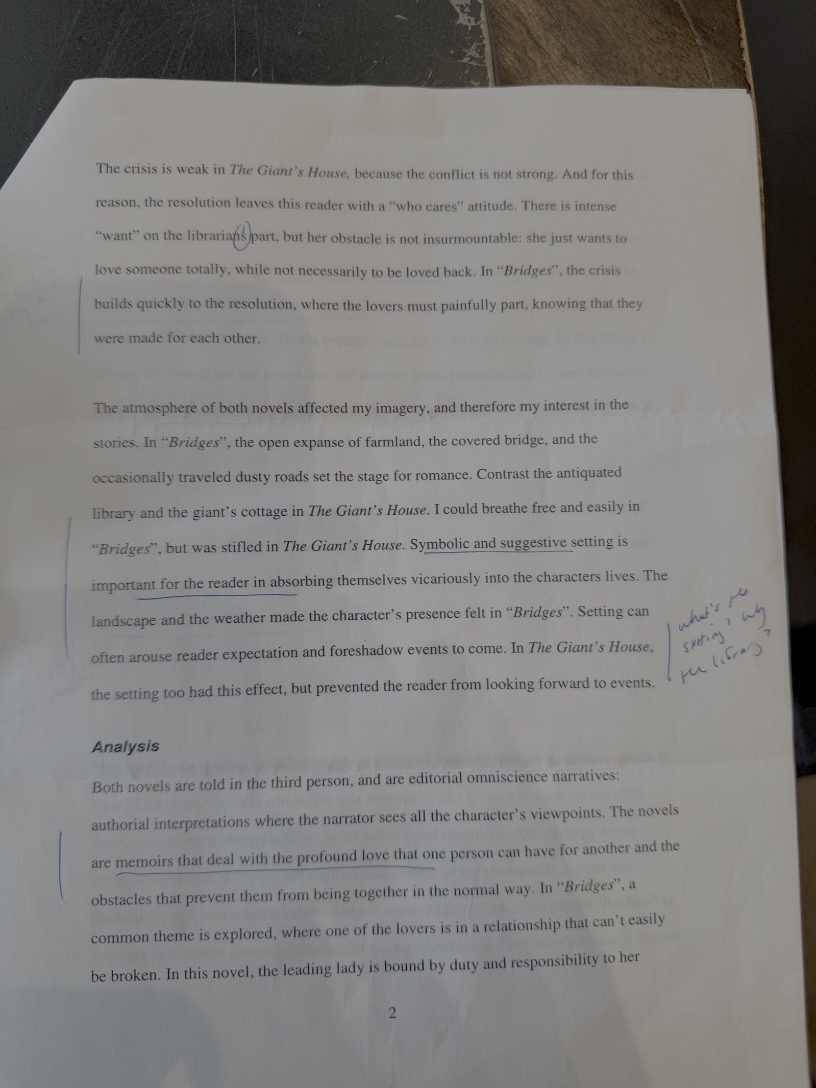 Page 2 of the essay, with the instructor's marks