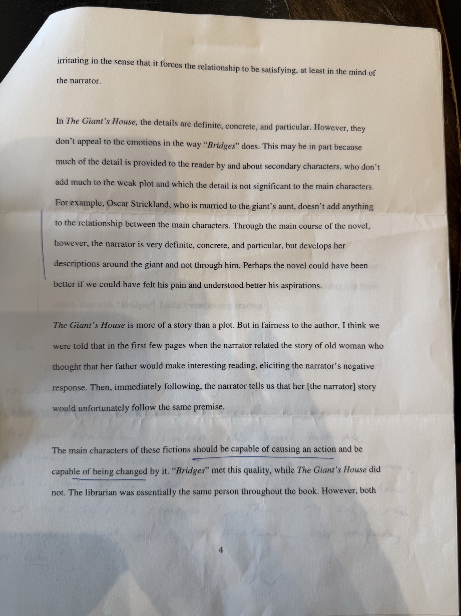 Page 4 of the essay, with the instructor's marks