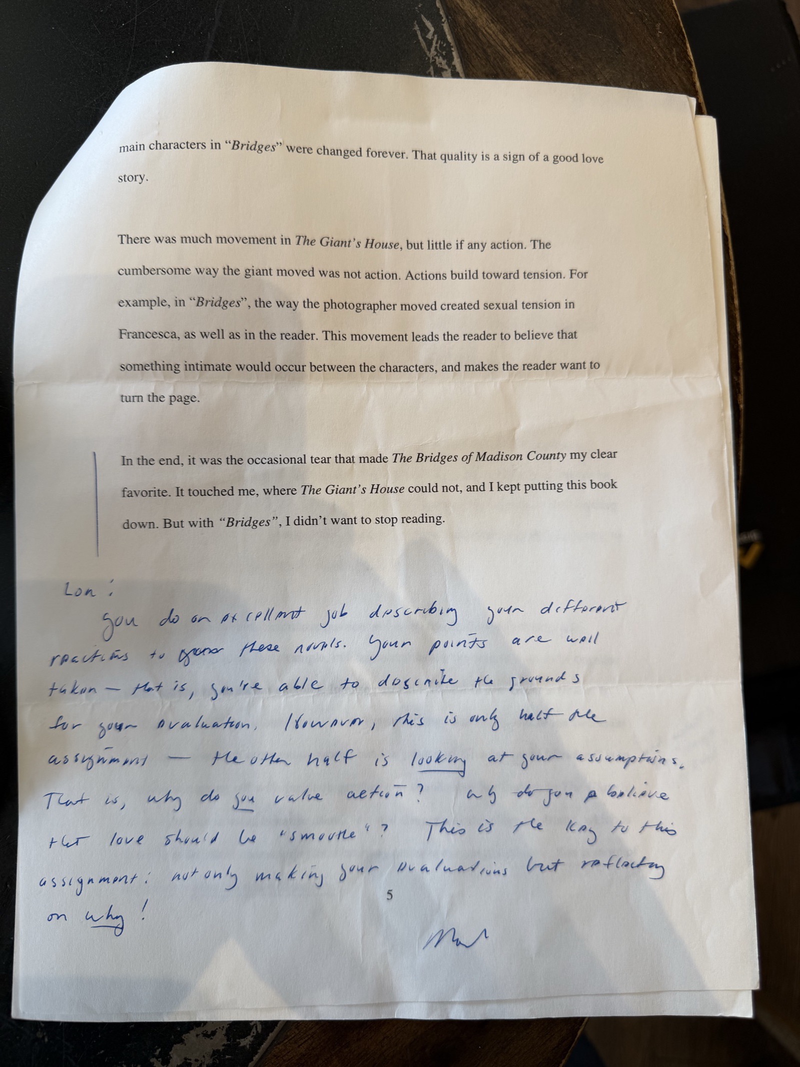 Page 5 of the essay, with the instructor's marks